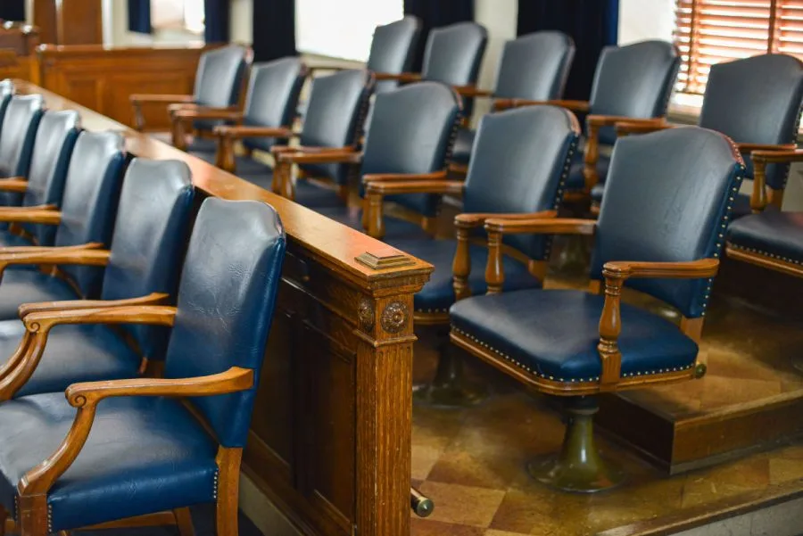 specialty-areas Jury seating area with arranged leather chairs in a courtroom, showing results of government cleaning services.